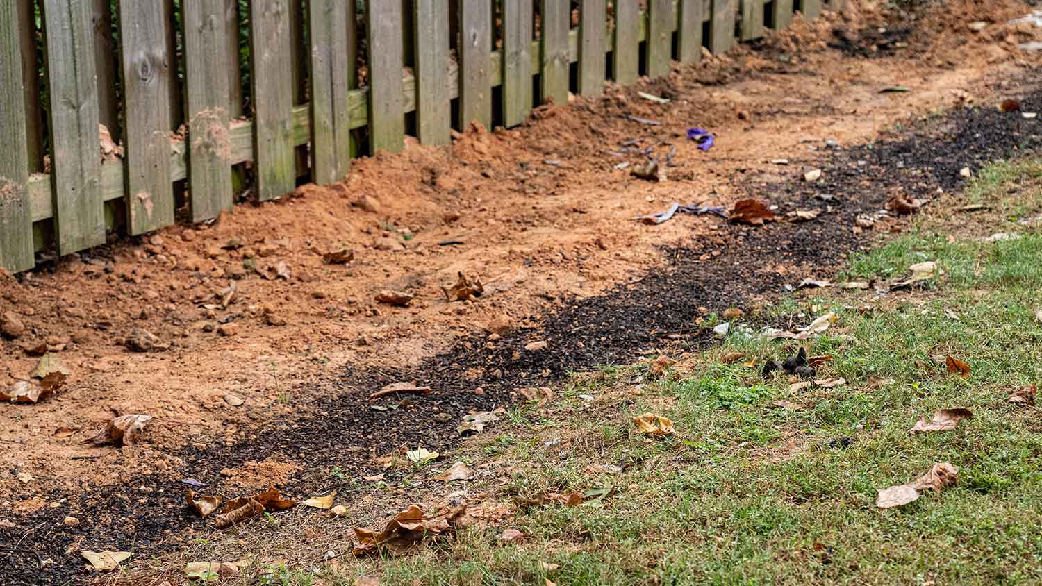 Sand covering trench in a yard