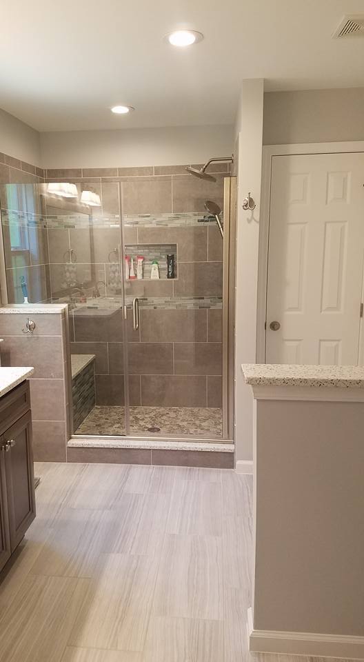 Grey bathroom with shower seat