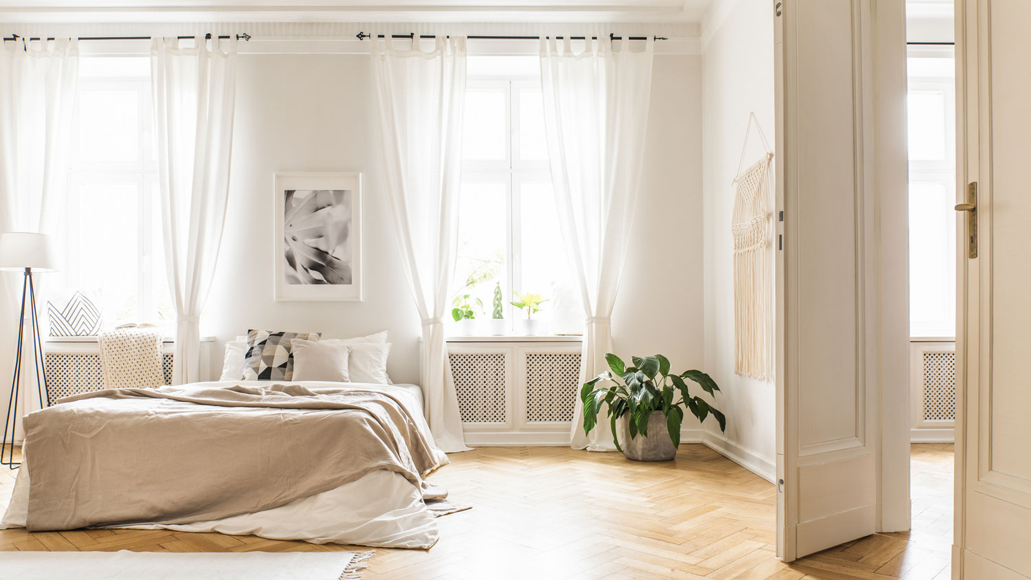 A spacious minimal bedroom with large windows