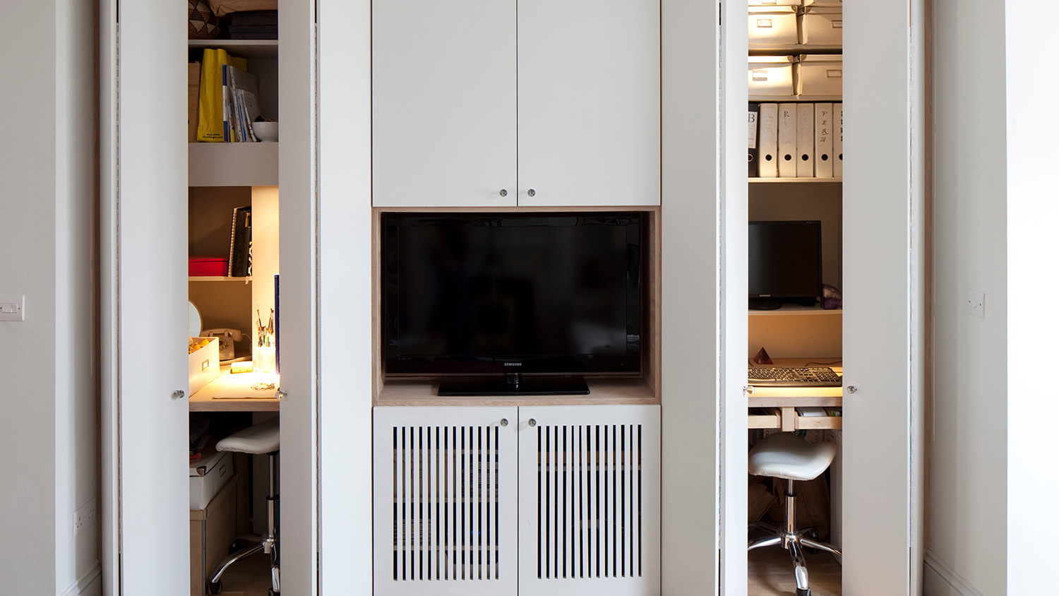 Tv storage in white shelves