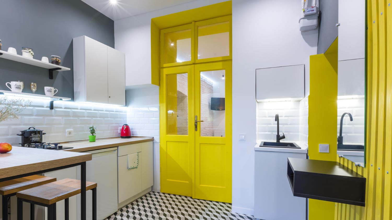 Modern loft style kitchen with yellow interior doors