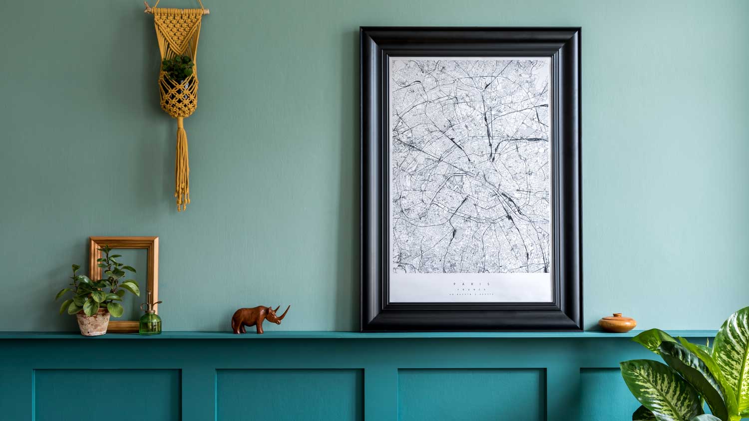 teal living room with wood paneling