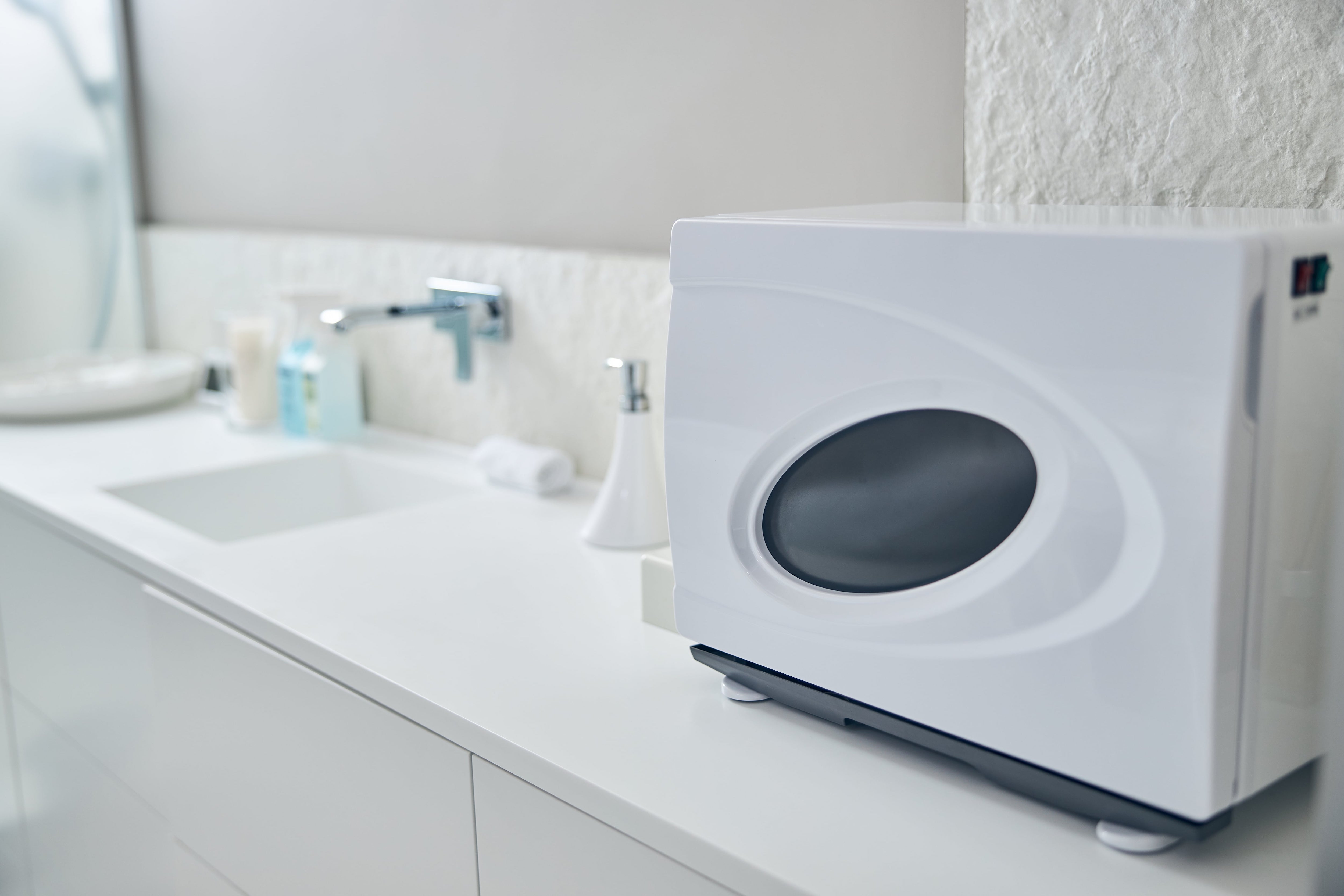 Towel warmer on countertop in bathroom