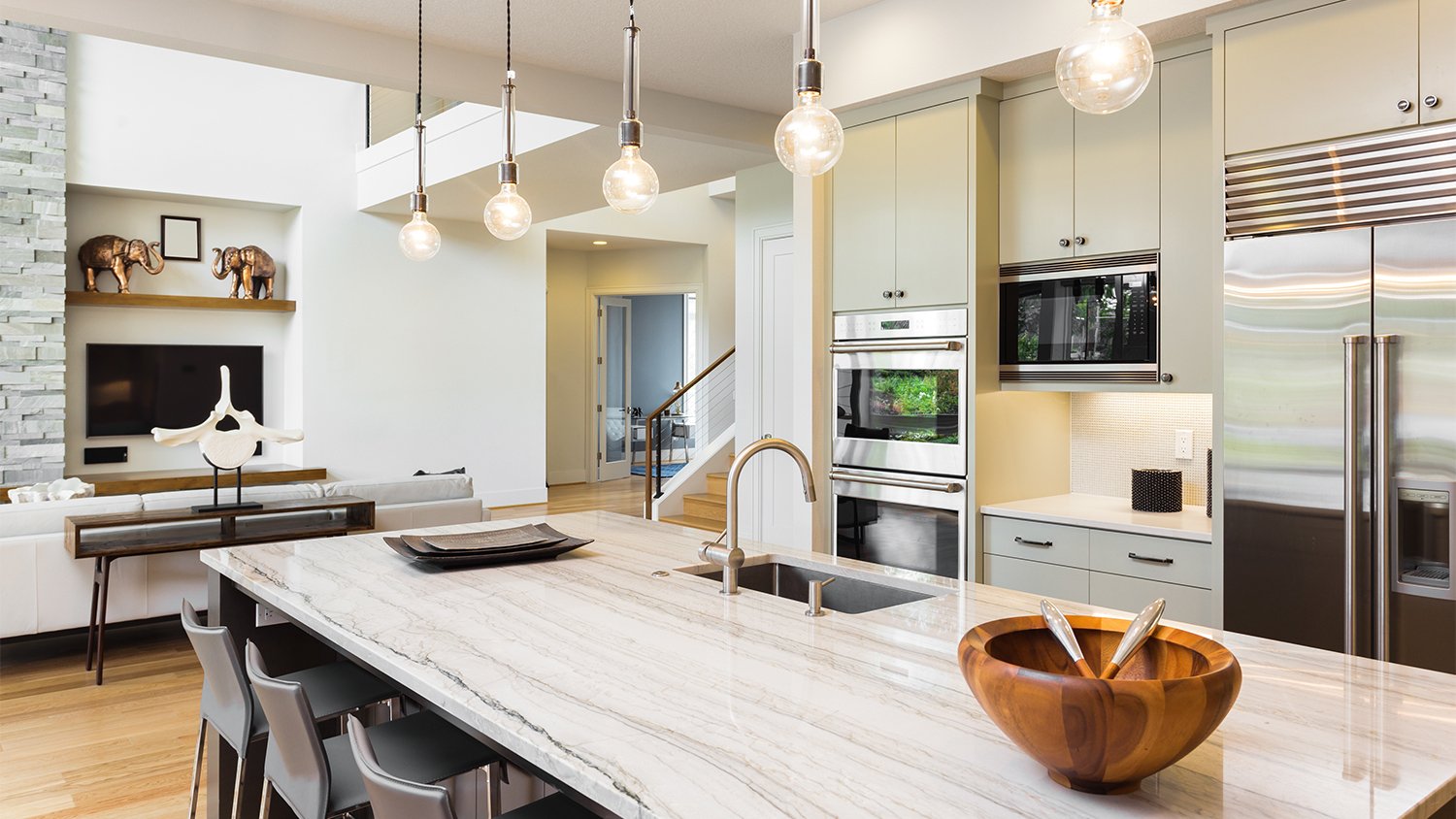 luxe kitchen area with travertine island