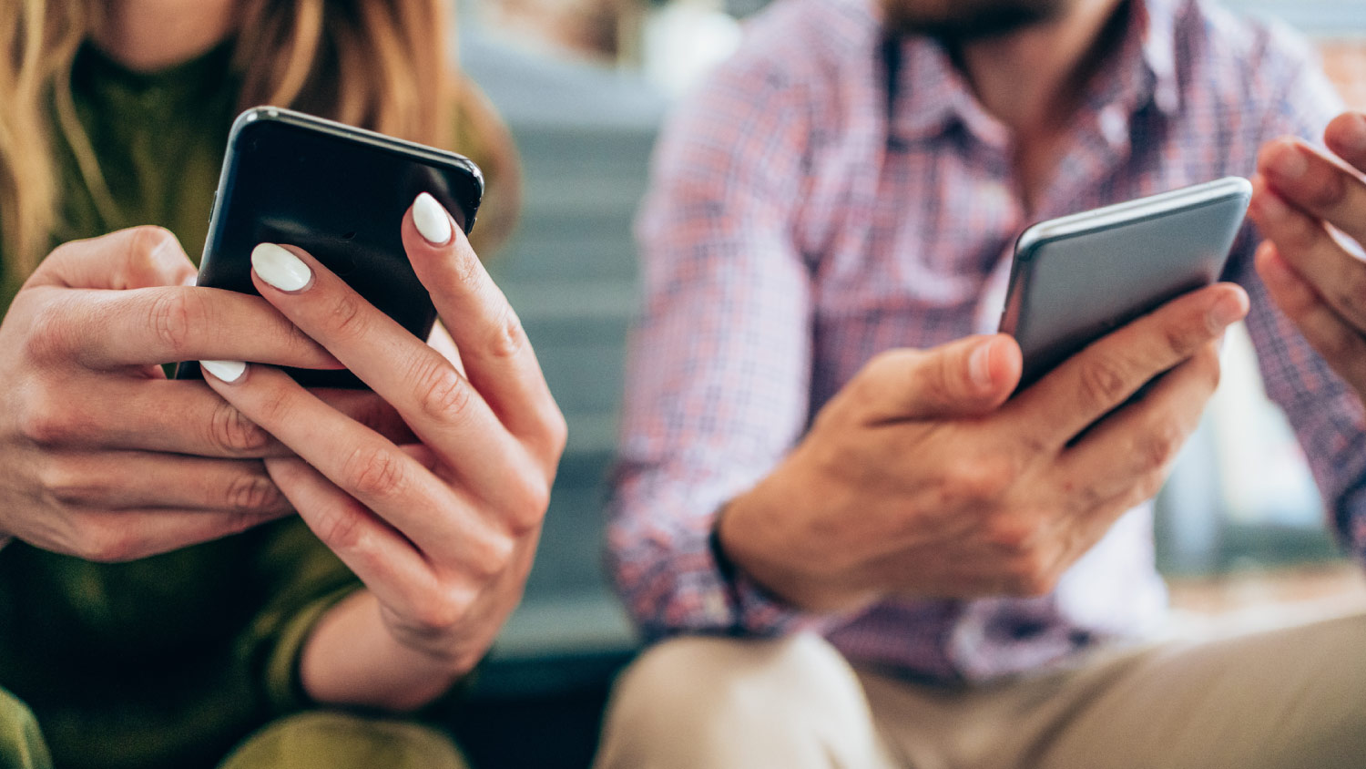 closeup of people using their smartphones