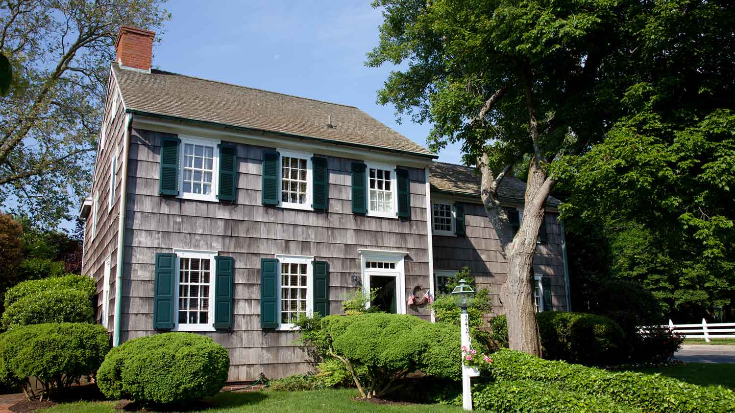 Two story house with wood shingles siding