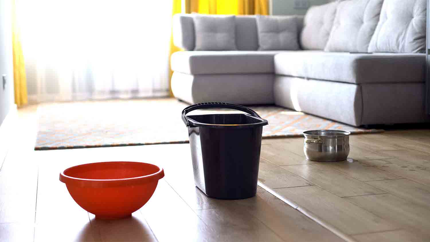 bucket to catch water from ceiling leak  