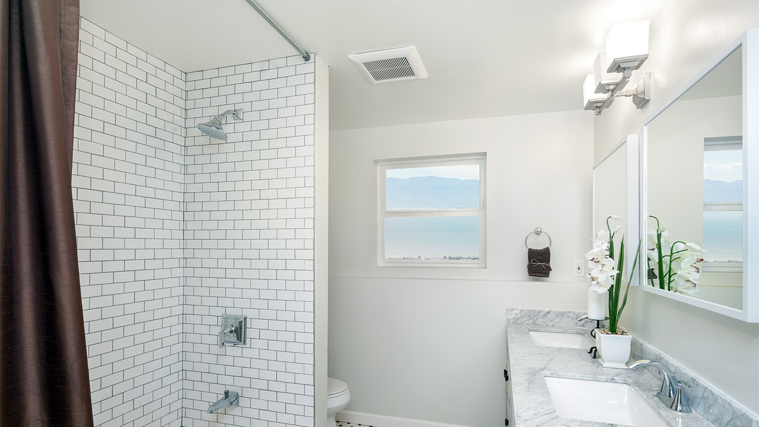 bathroom with high shower curtain rod