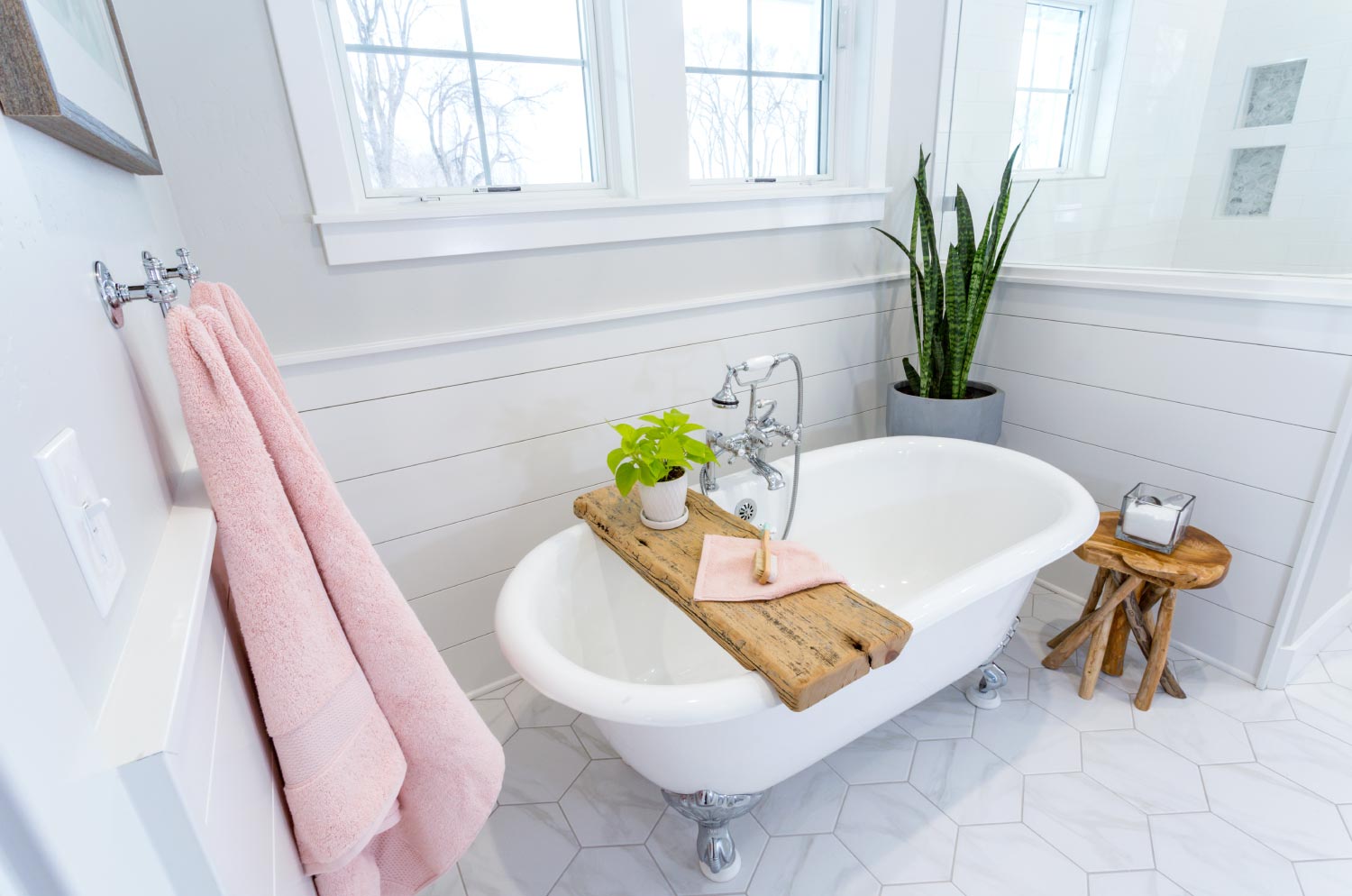 A white bathroom with a bathtub