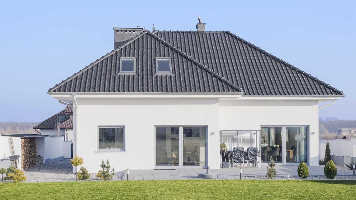 White suburban house with gray roof