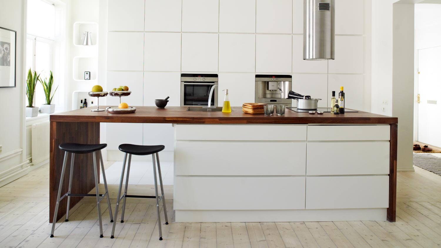 A white kitchen with breakfast bar
