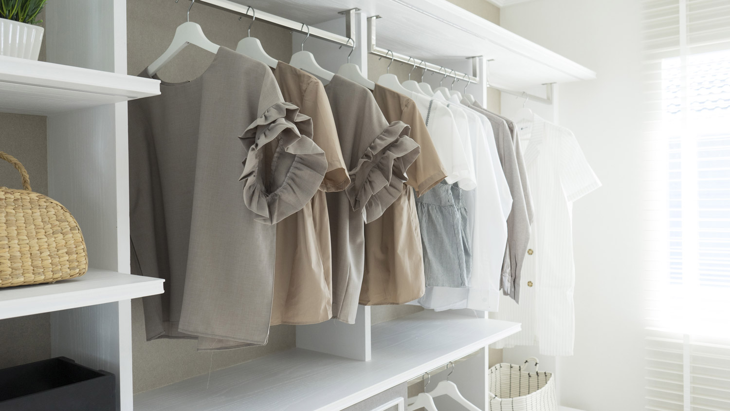 A white wardrobe with natural light coming in from the window