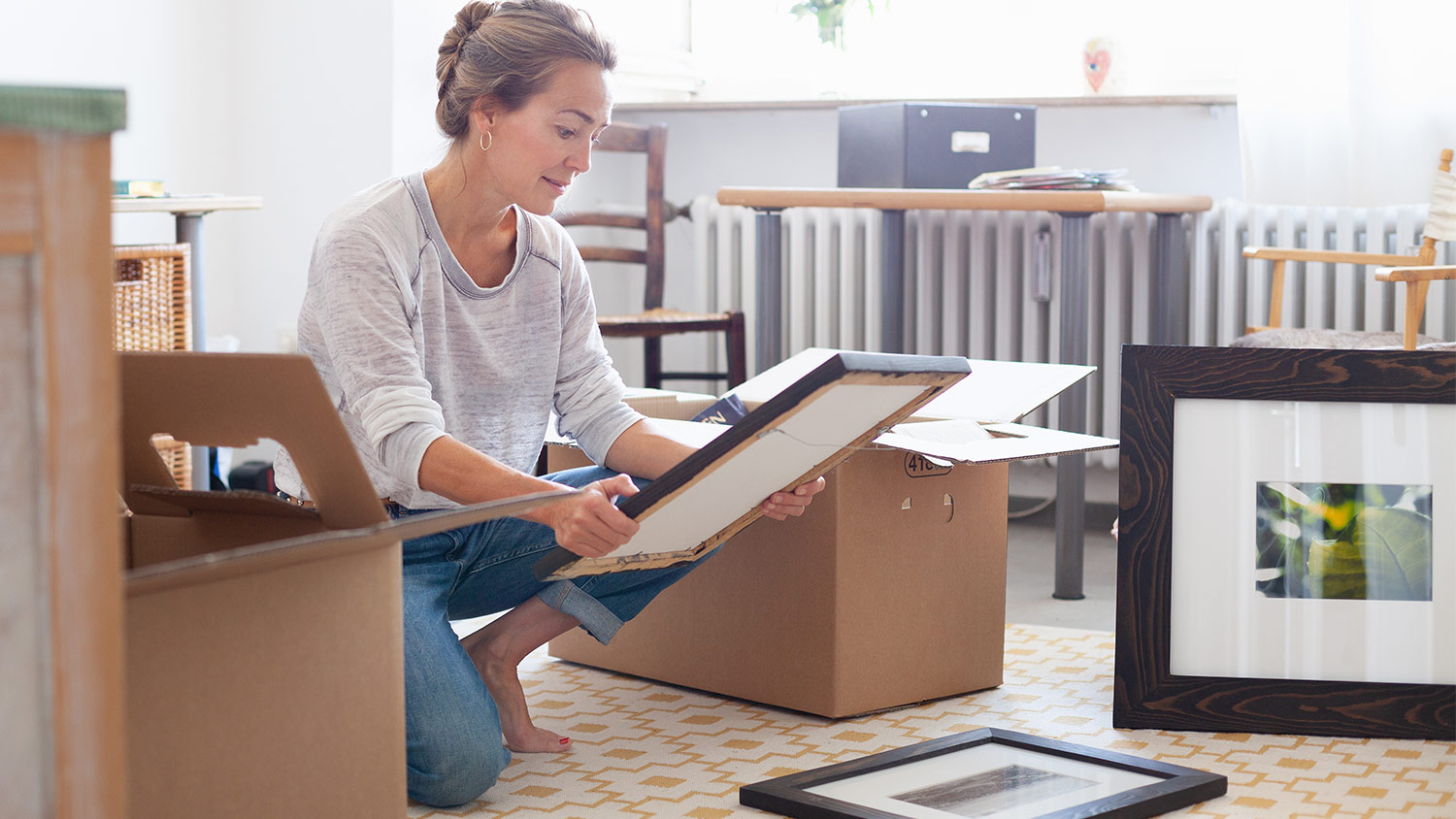 Woman with boxes and artwork