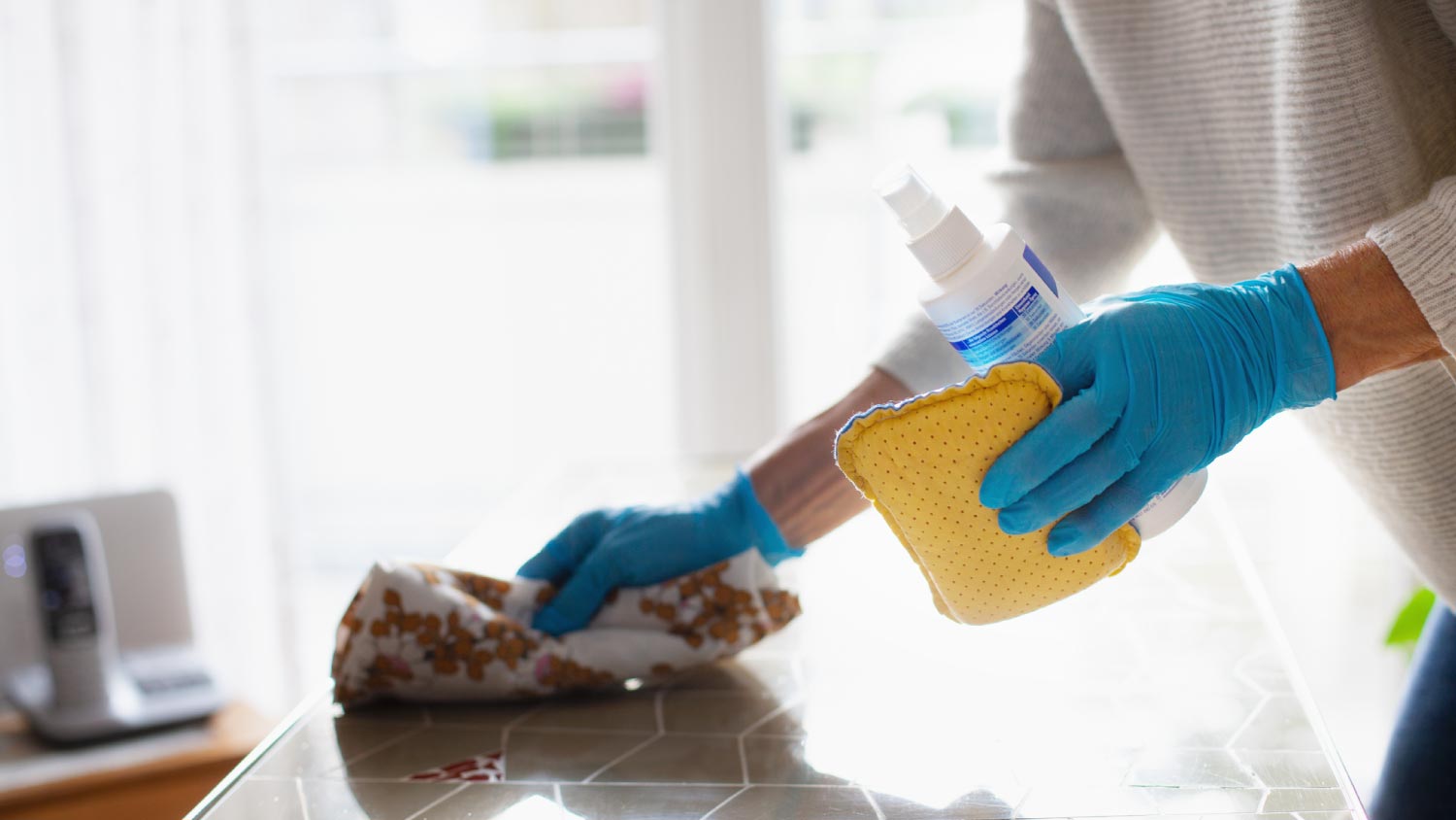 A woman cleaning a table