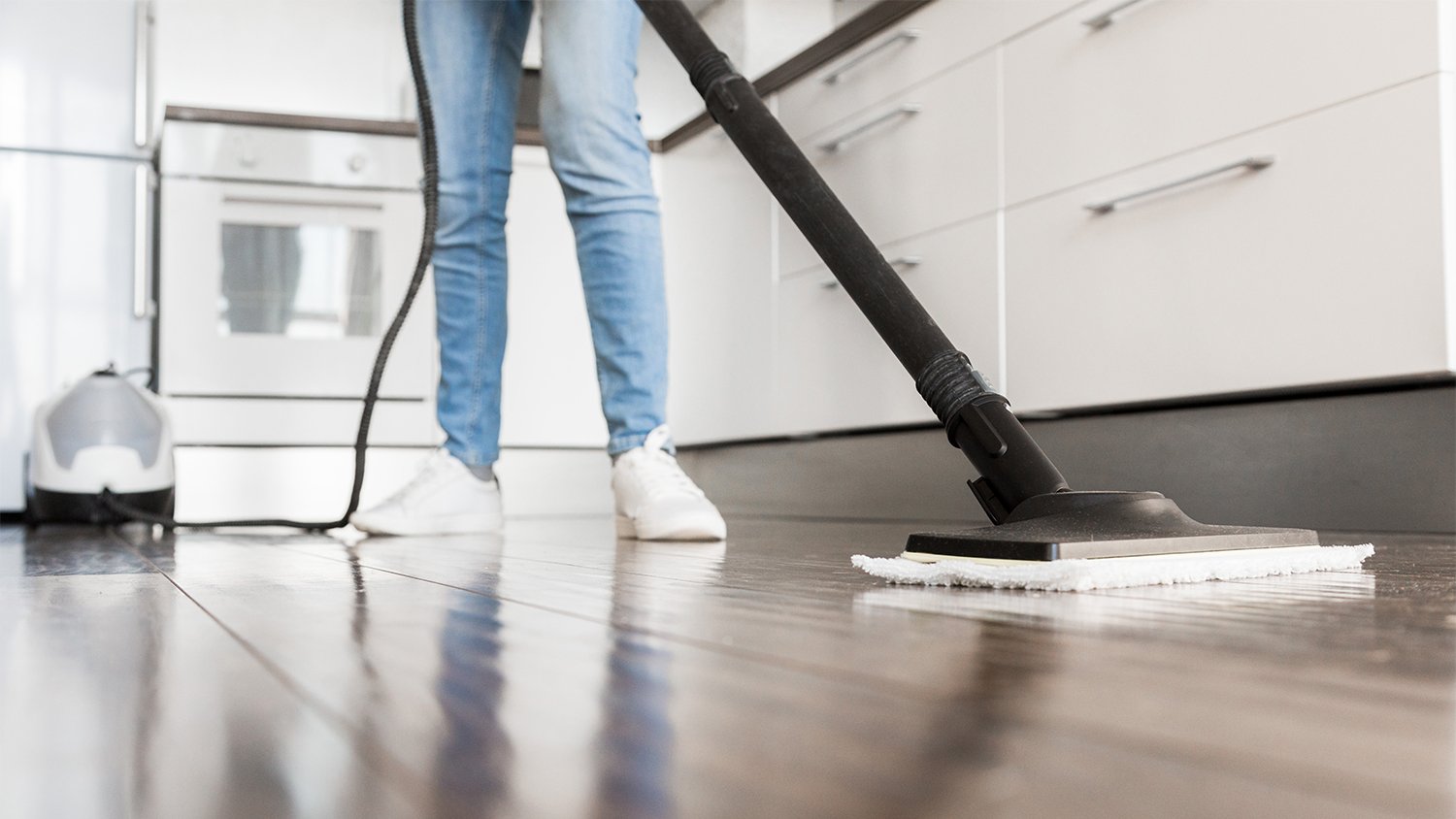 woman cleaning wood floors