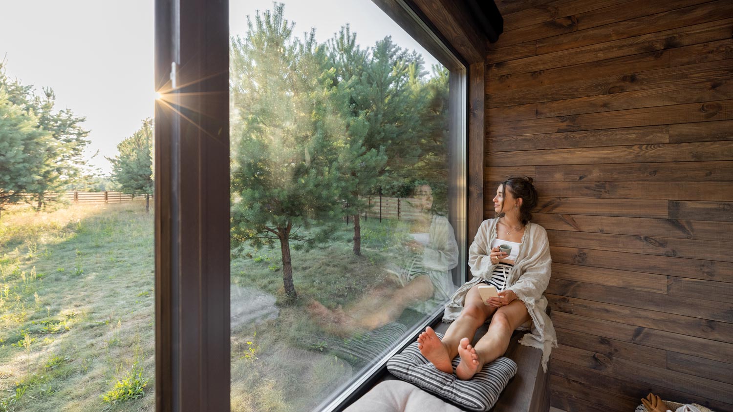 A woman enjoying the view from her window