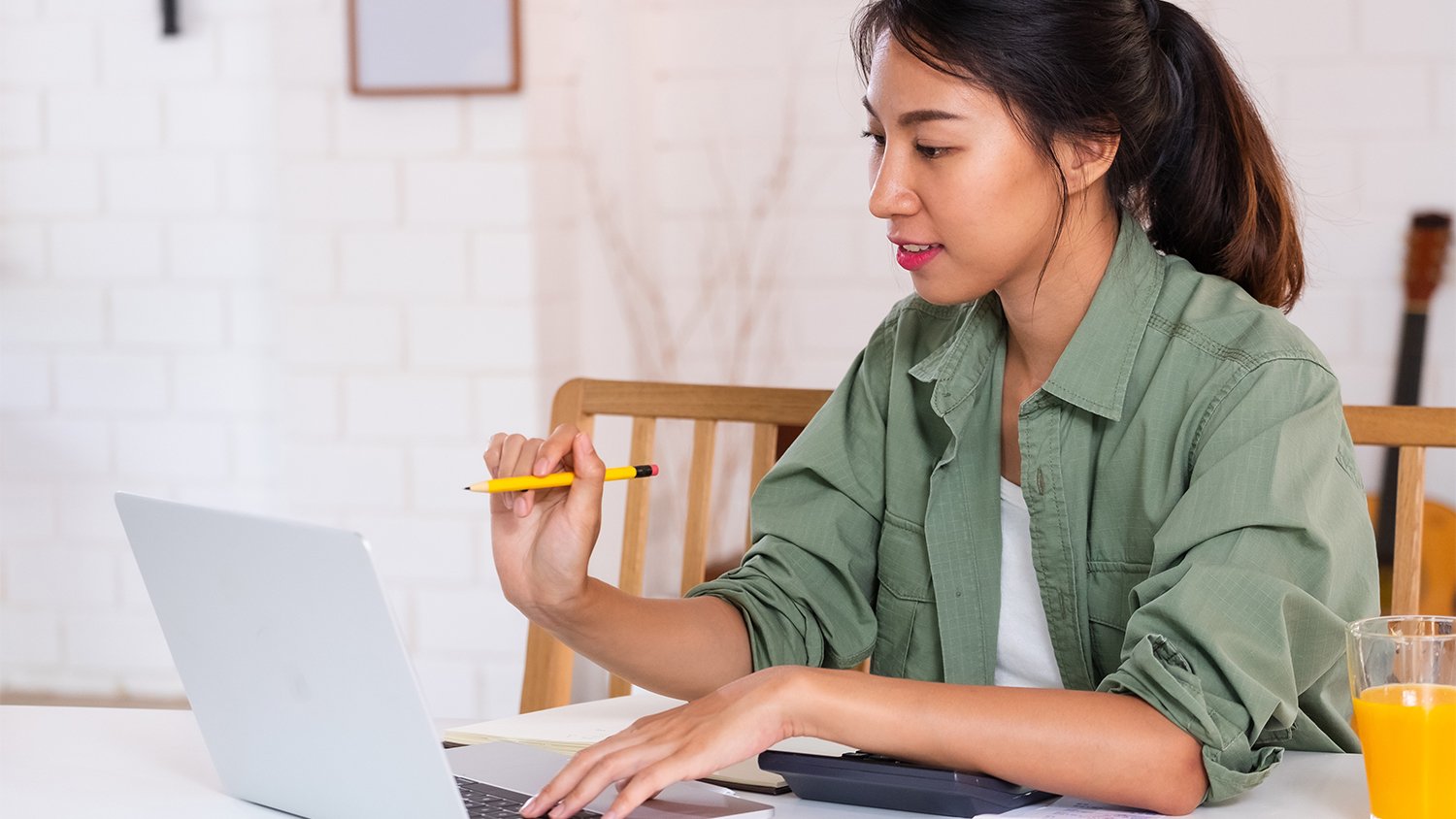 woman on laptop budgeting home project