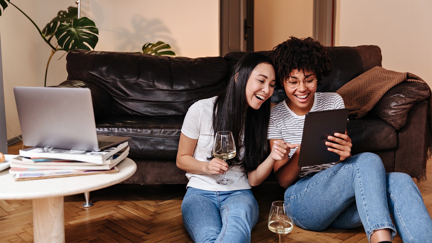 two women hanging out in apartment   