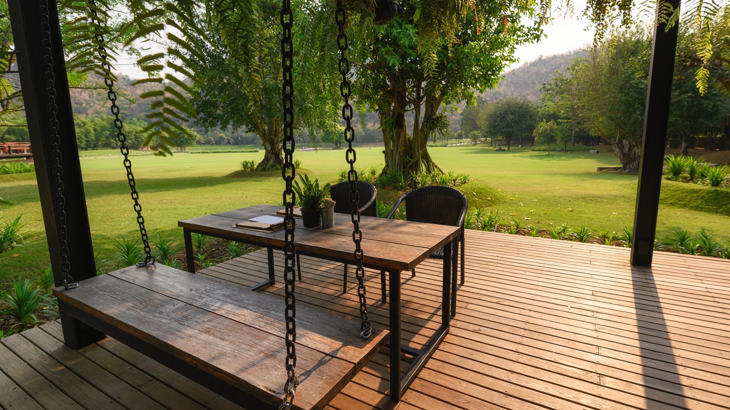 Wooden chairs and table on a patio