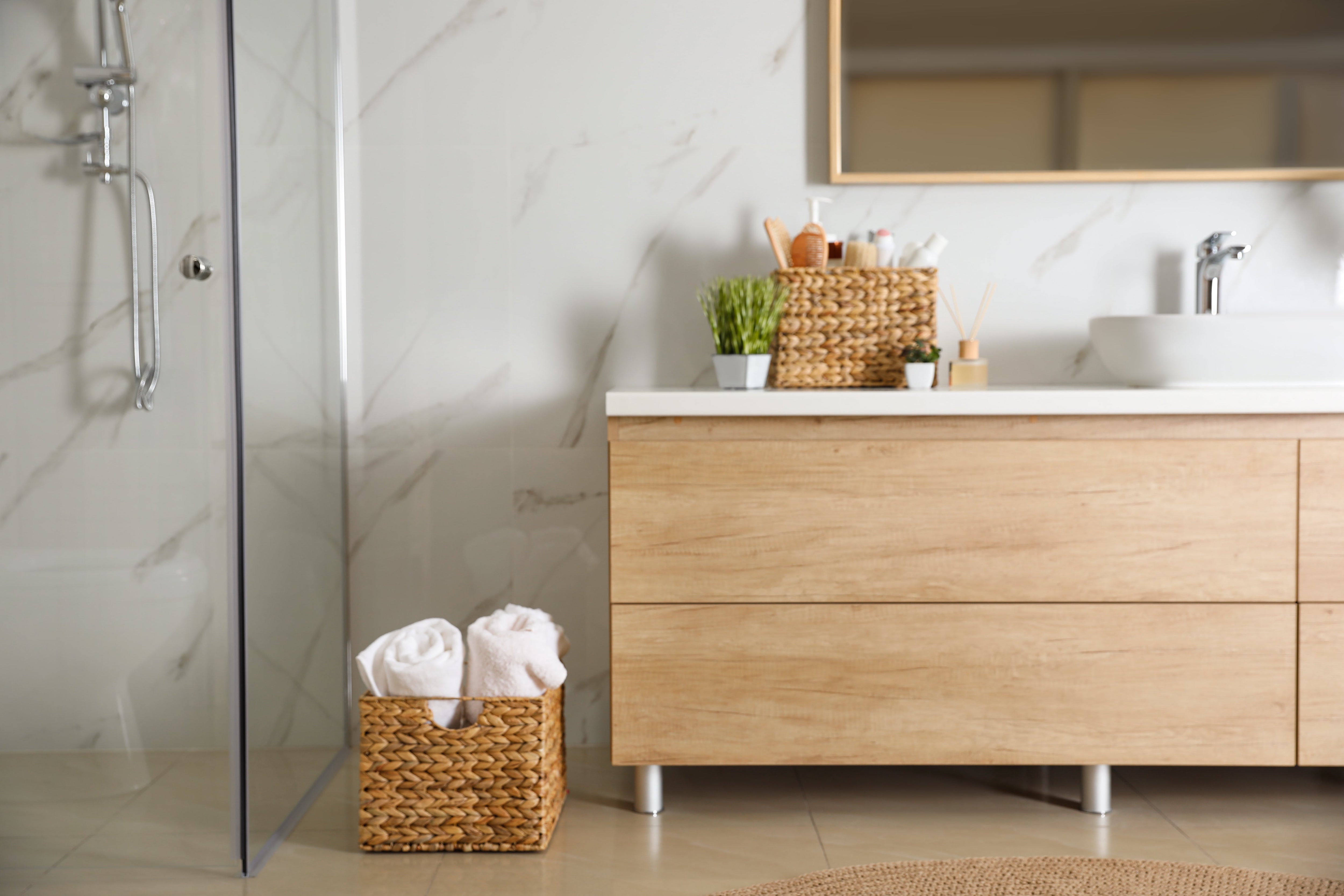 Woven storage baskets in modern bathroom